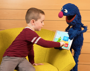 Sesame Street's Grover with a young child