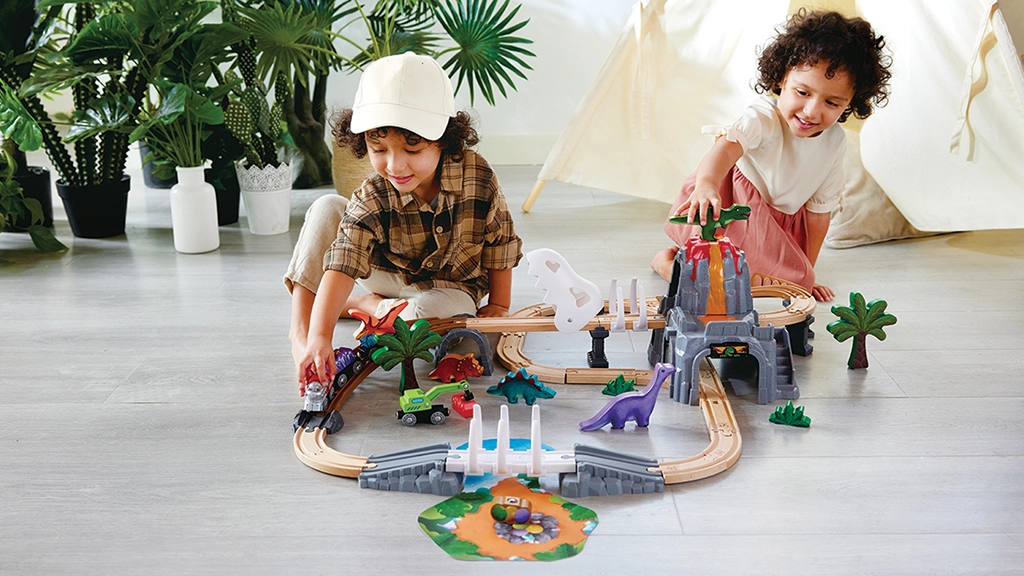 Stock This 55 New Toys Games To Look For In 2024 The Toy Book   Hape Dino Railway Adventure Set TBTFNY.webp